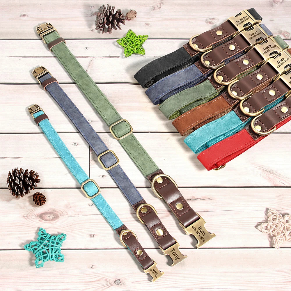 Set of colorful leather dog collars with brass buckles on a wooden surface.